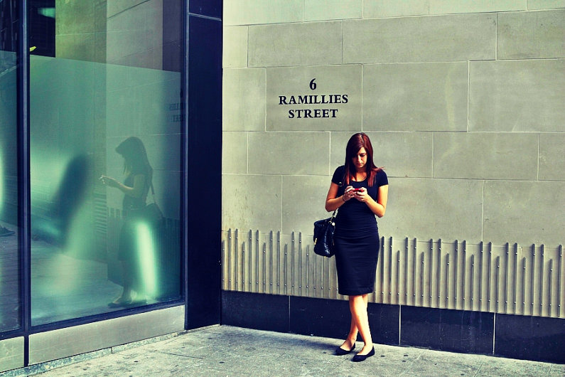 Businesswoman in front of London office building